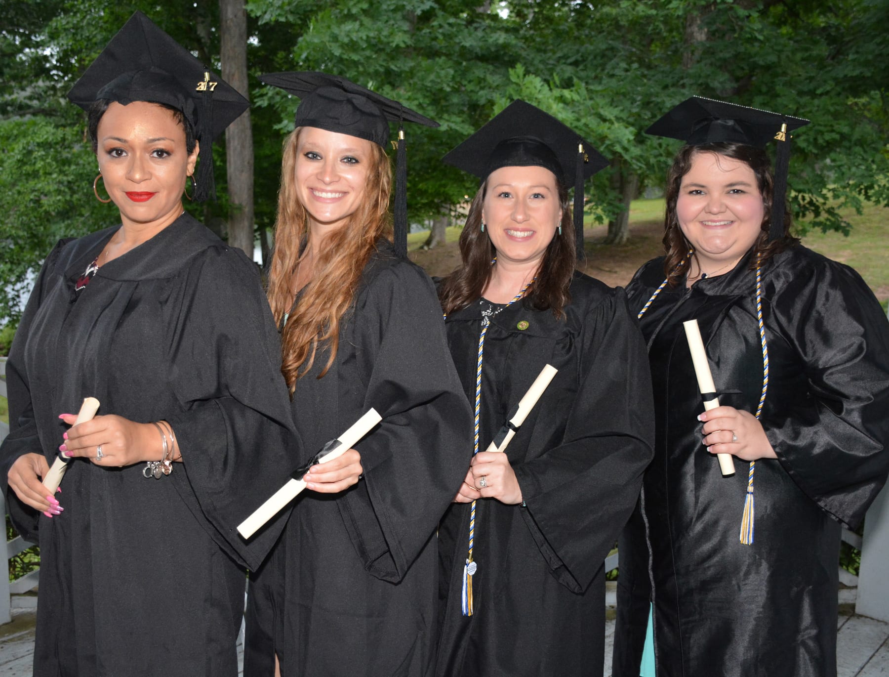 When six students walked across the stage to receive their degrees at ...